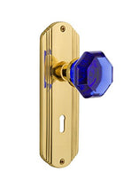 Load image into Gallery viewer, Nostalgic Warehouse 726195 Deco Plate Interior Mortise Waldorf Cobalt Door Knob in Polished Brass, 2.25 with Keyhole
