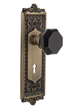 Load image into Gallery viewer, Nostalgic Warehouse 721571 Egg &amp; Dart Plate with Keyhole Passage Waldorf Black Door Knob in Antique Brass, 2.375

