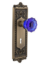 Load image into Gallery viewer, Nostalgic Warehouse 721527 Egg &amp; Dart Plate with Keyhole Passage Crystal Cobalt Glass Door Knob in Antique Brass, 2.375
