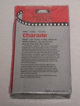 Load image into Gallery viewer, 1964 Charade - Cary Grant, Audrey Hepburn, Walter Matthau, James Coburn - VHS (SEALED)
