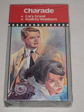 Load image into Gallery viewer, 1964 Charade - Cary Grant, Audrey Hepburn, Walter Matthau, James Coburn - VHS (SEALED)

